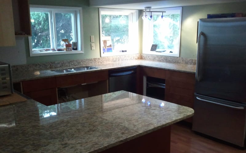 Newly installed granite countertops in a finished kitchen