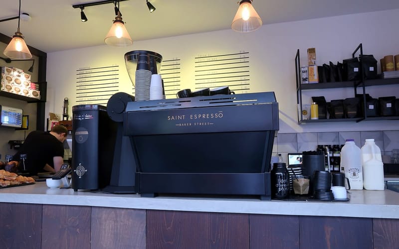 A minimalist coffee bar with an espresso machine